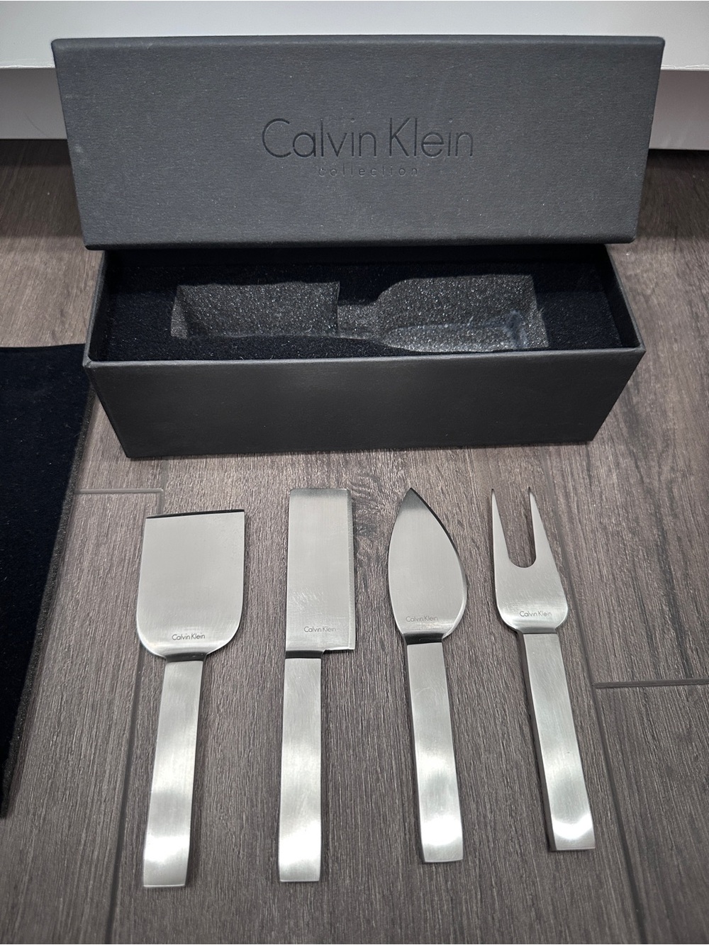 Calvin Klein stainless steel cheese serving set by Calvin Klein Home collection.